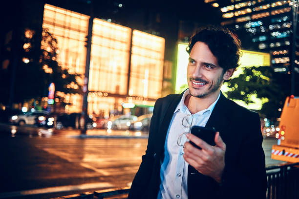 istock man using his smartphone after work in the city 1142213004