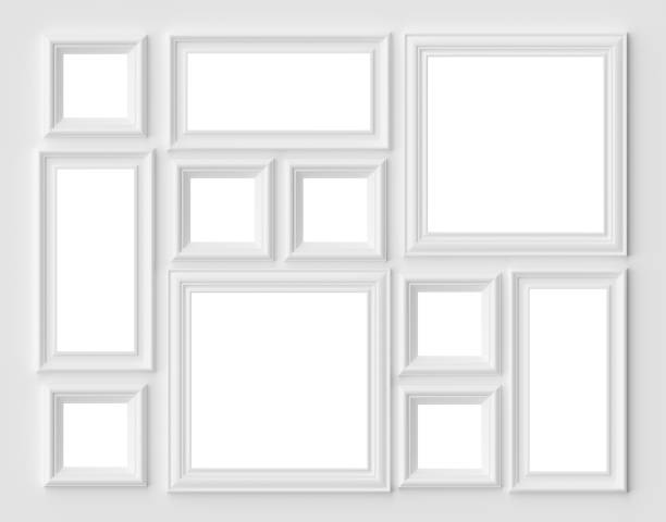 istock White picture or photo frames on the white wall with copy-space 1142213081