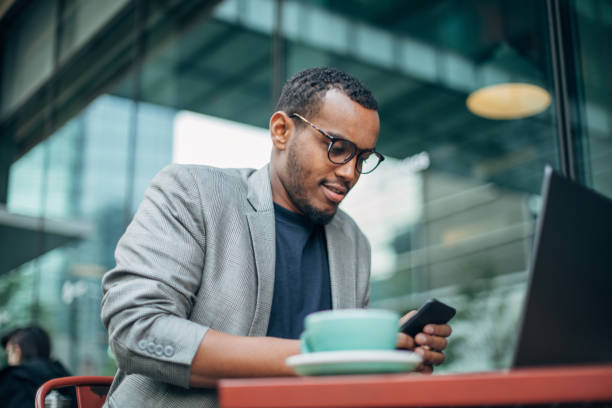 istock Man sitting in coffee shop and using phone 1142219183