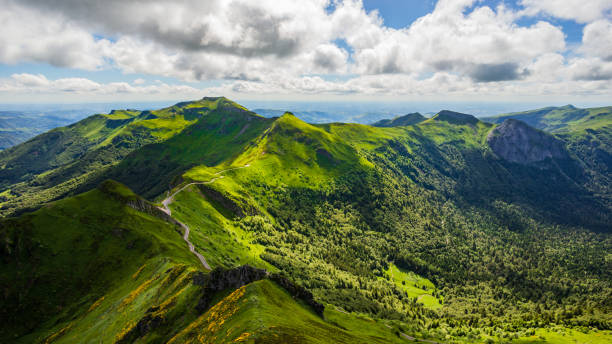 Landscape of volcanic mountains in Alps, France Landscape of volcanic mountains (view from Puy Mary, Massif Central, France) auvergne rhône alpes photos stock pictures, royalty-free photos & images