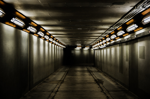 Temporary concrete underground walkway crossing a construction site in city center of Hong Kong