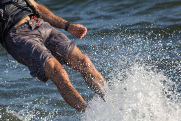 istock Close-up on splash of a kiteboarding surfboard surfing a wave 1142226495