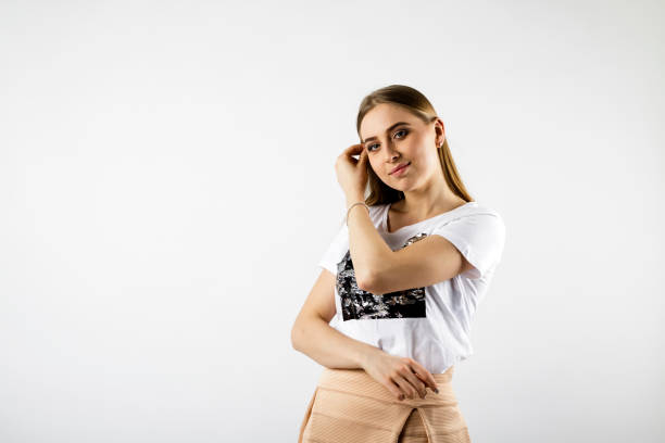 istock Young attractive woman in white isolated on bright background. 1142229357