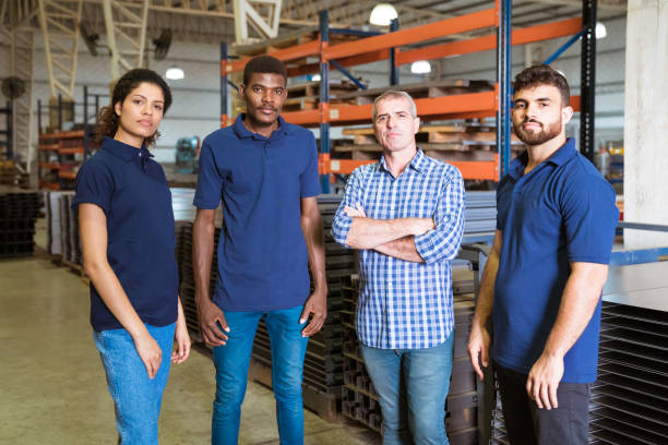 istock Confident workers standing in factory 1142229382