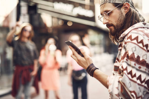 istock Positive male using modern phone 1142229867