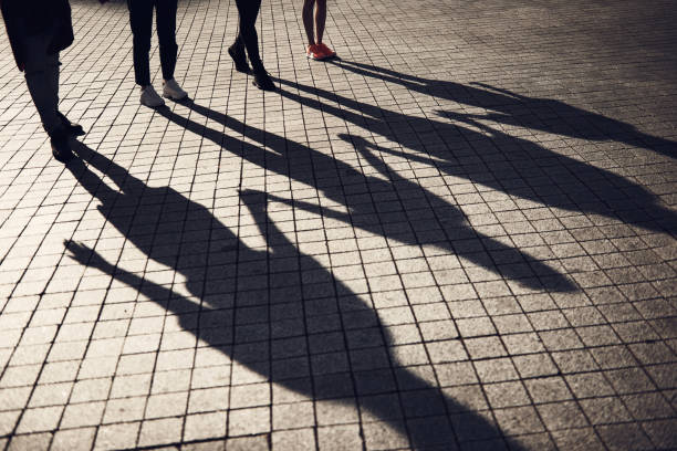 istock Women and males legs with silhouettes 1142229885