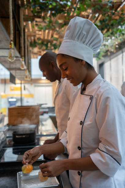 istock Happy chefs cooking in a kitchen at a restaurant 1142230161
