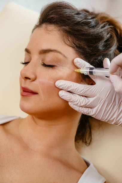 istock Woman receiving botox injection 1142233976