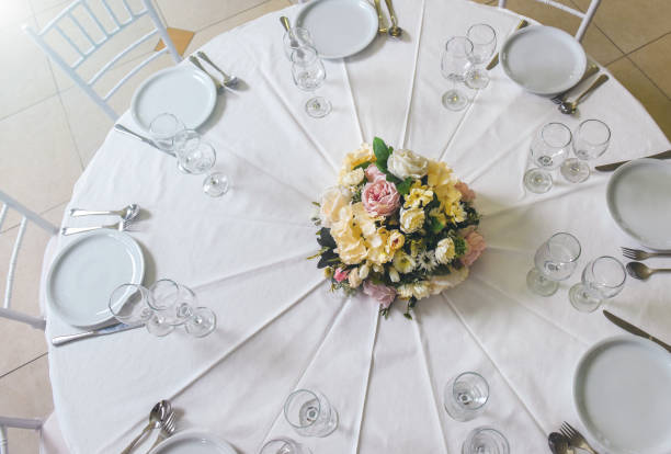 istock Woman arranging flowers for wedding celebration 1142234706