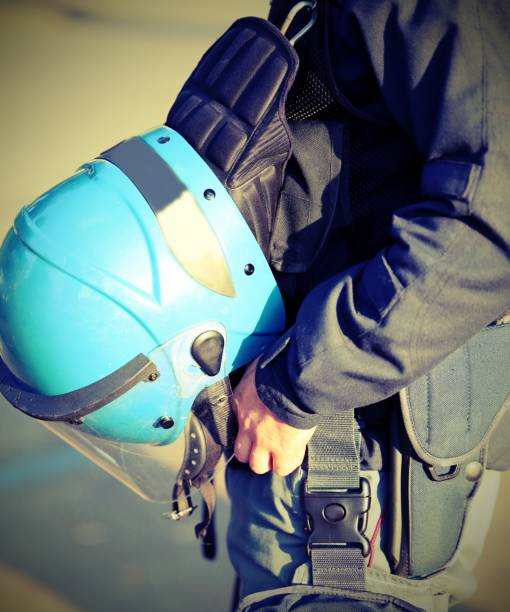 istock blue helmet of a policeman with old toned effect 1142234838