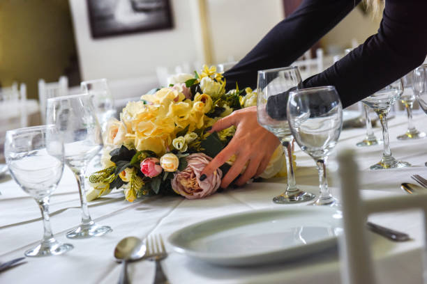 istock Woman arranging flowers for wedding celebration 1142235801