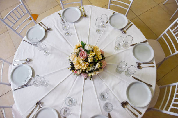 istock Woman arranging flowers for wedding celebration 1142235836