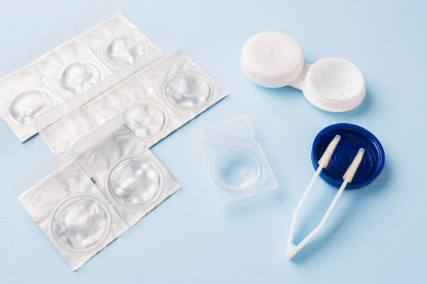 istock Contact lenses, tweezers and lens storage container. Close up. Selective focus. 1142235918