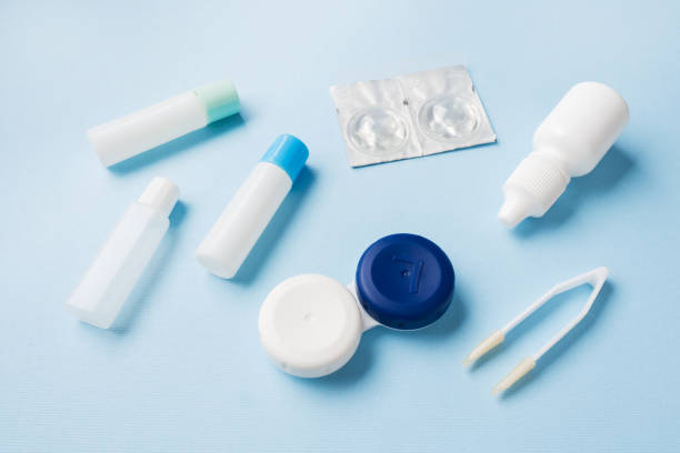 istock Contact lenses, tweezers and a container for storing lenses, containers for solution and moisturizing drops. Close up. Selective focus. 1142236864
