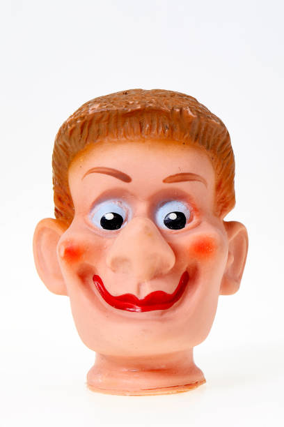 istock Vintage finger punch puppet, young smiling funny boy 1142237019