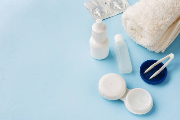 istock Contact lenses, tweezers and a container for storing lenses, containers for solution and moisturizing drops. Close up. Selective focus. 1142237024