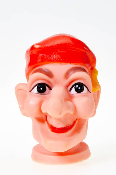 istock Vintage finger punch puppet, young smiling funny boy 1142237042