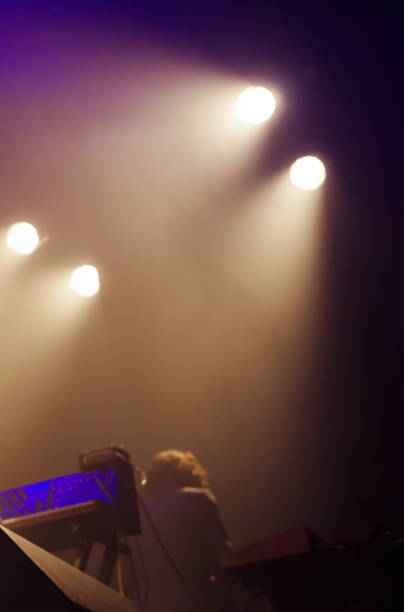 istock Ambient stage light and rock band live performance in a livehouse 1142237193