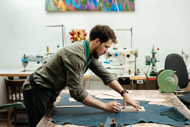 istock A master sketches for goods from natural leather in his workshop 1142238519