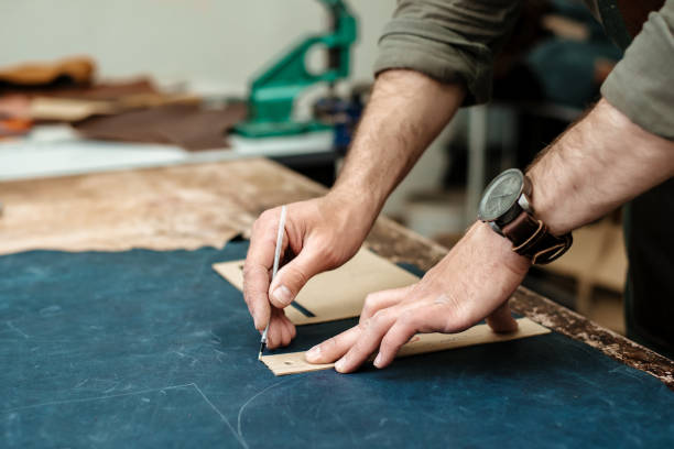 istock A master sketches for goods from natural leather in his workshop 1142238536