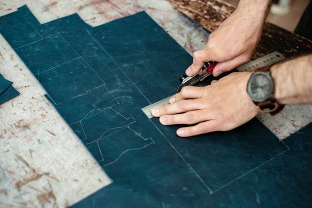 istock A master cuts natural leather for goods in his workshop 1142238599