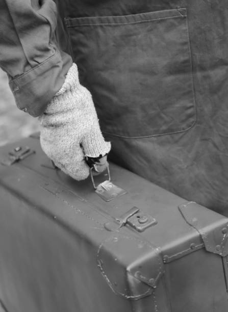 istock immigrant with old leather suitcase during the trip abroad with 1142238848