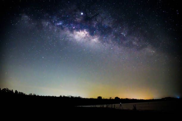 istock milky way at the lake before sunrise time 1142238921