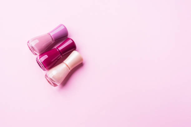 istock Pink nail polishes on monochrome background 1142238961