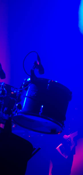 istock Ambient stage light and rock band live performance in a livehouse 1142238965