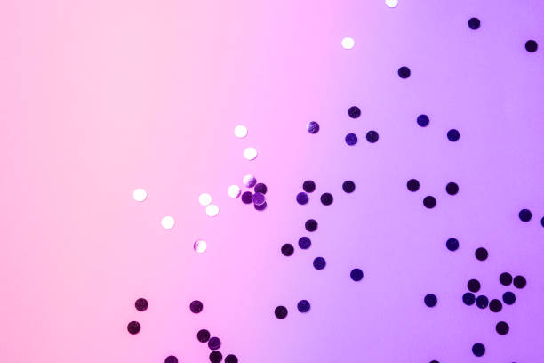 istock Sparkling confetti on pink purple background 1142238984