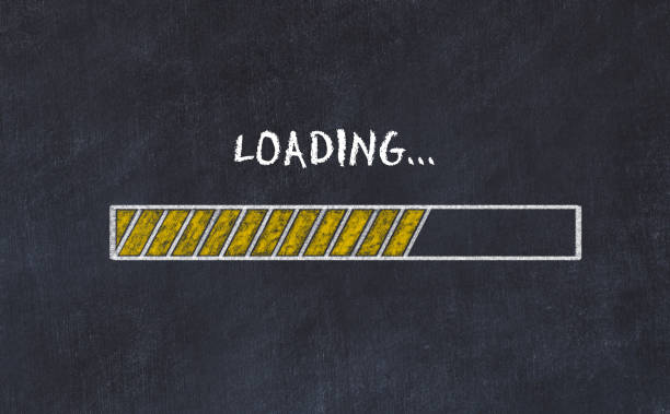 Chalk csetch of progress bar on black board and inscription loading. stock photo