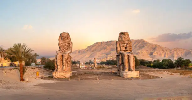 Egypt. Luxor. The Colossi of Memnon - two massive stone statues of Pharaoh Amenhotep