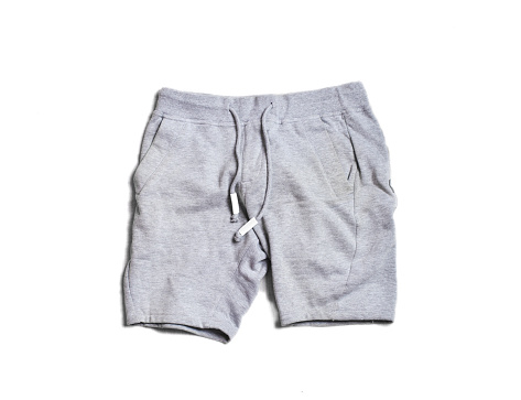 Sport gray mens shorts pants isolated on white background. Hype fashion magazine photo urban style.