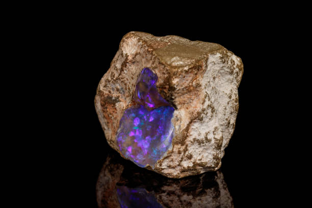 istock Macro stone Opal mineral in rock on a black background 1142244806