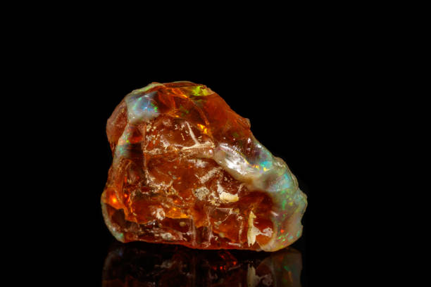 istock Macro stone Opal mineral in rock on a black background 1142244830