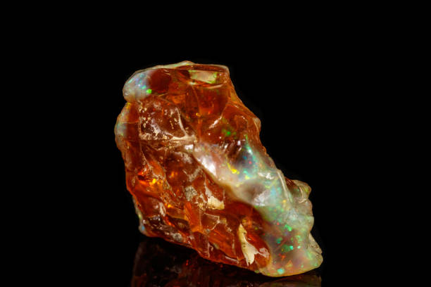 istock Macro stone Opal mineral in rock on a black background 1142245158