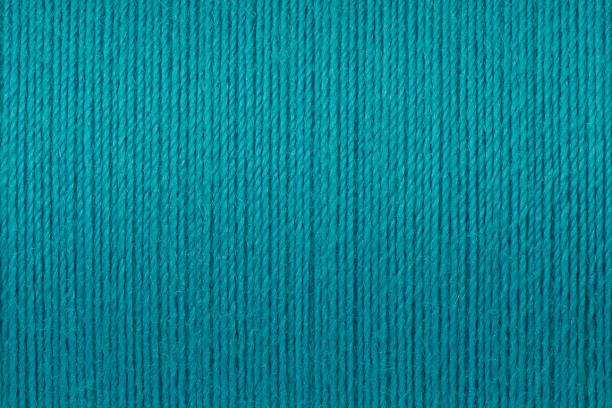 Macro picture of turquoise thread texture background
