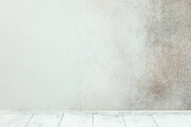 Empty white wooden table in front of stone wall Empty white wooden table in front of stone wall. Copy space stone bench top view stock pictures, royalty-free photos & images
