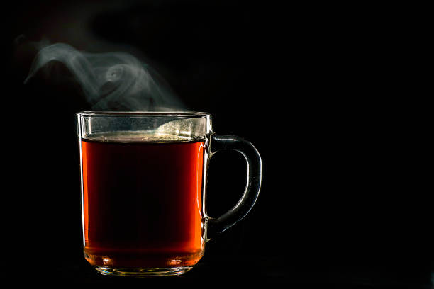 istock A cup of hot tea on a black background 1142254062