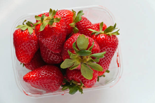 istock retail strawberries at the market. 1142259326