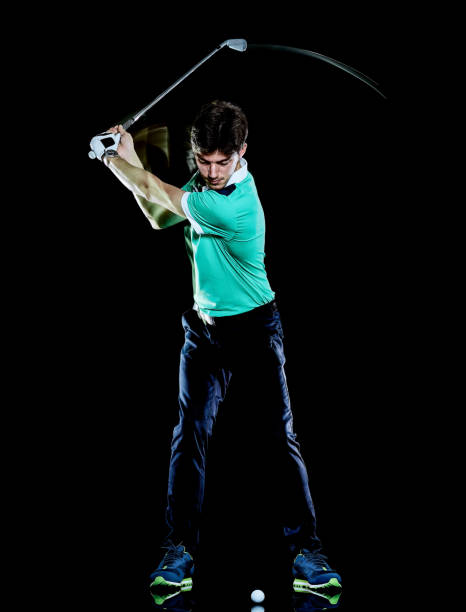 istock Golfer man golfing golf swing isolated black background multiple exposure 1142260627