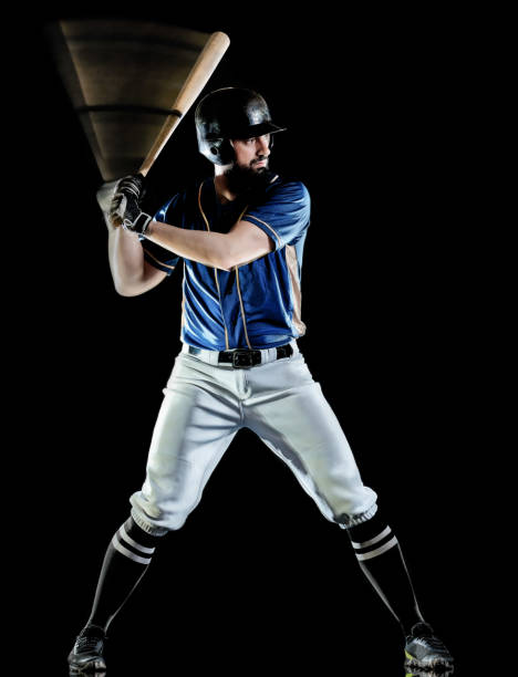istock baseball player man isolated black background light painting 1142260750