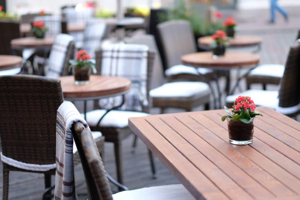 istock Empty tables of street cafes 1142262624