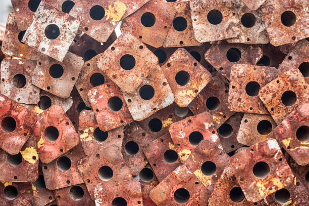 Pile of scrap rusty grunge metal plates covered in rust. Close up