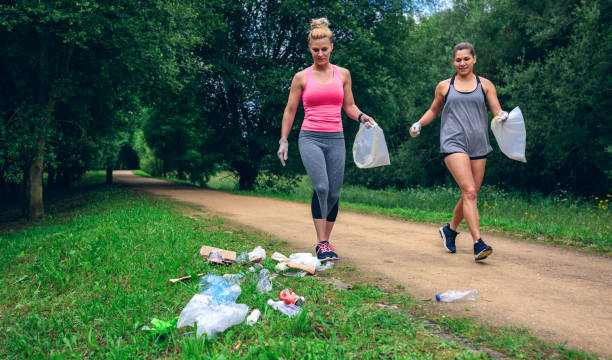 istock Waste pile and two girls doing plogging 1142263087
