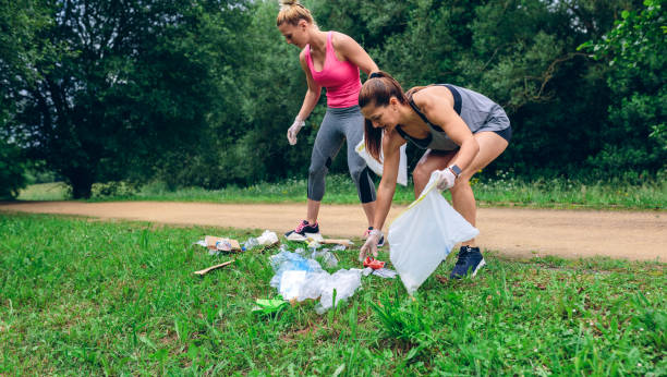 istock Waste pile and two girls doing plogging 1142263088