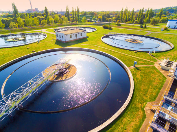 Aerial view to sewage treatment plant. Grey water recycling. Waste management in European Union. Aerial view to sewage treatment plant. Grey water recycling. Waste management in European Union. sewage stock pictures, royalty-free photos & images