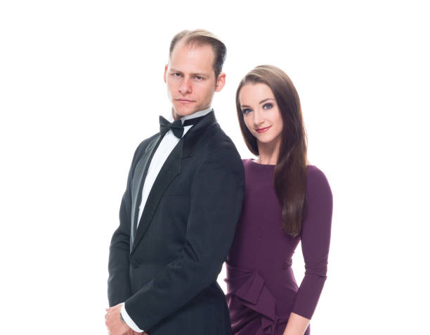 istock Handsome man with beautiful woman on white background 1142267440