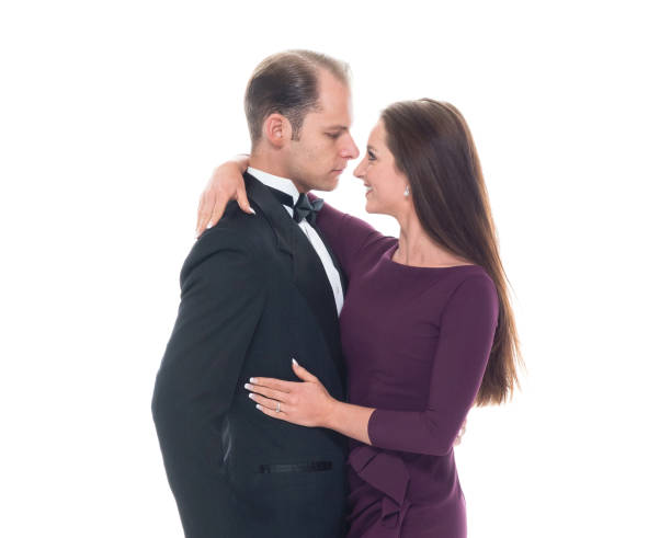 istock Beautiful couple dancing together while wearing formal wear 1142267667
