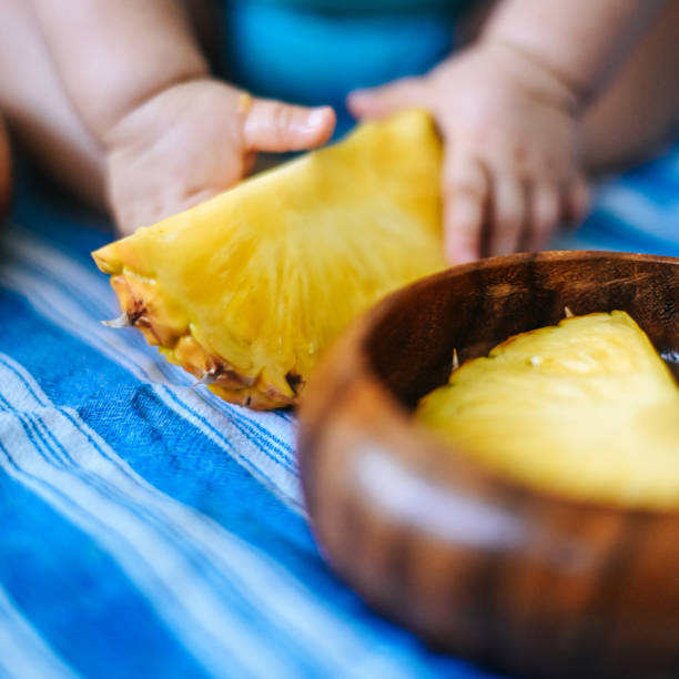 Pineapple and baby, sweet snack cute child